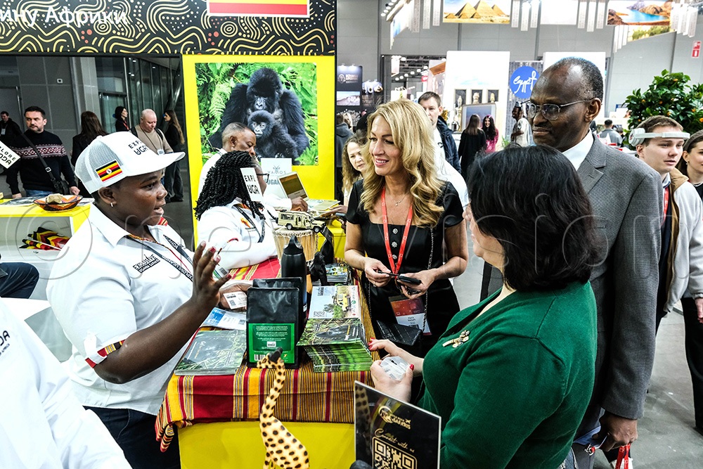 Maxim Shilov (C) (MITT Event Director) and right, Gideon Rutazindwa, (Uganda Deputy Head of Mission to Russia) touring the Ugandan stall during the Moscow International Travel and Tourism (MITT) Expo in Moscow, on March 12 2026. (Photo by Hajarah Nalwadda)