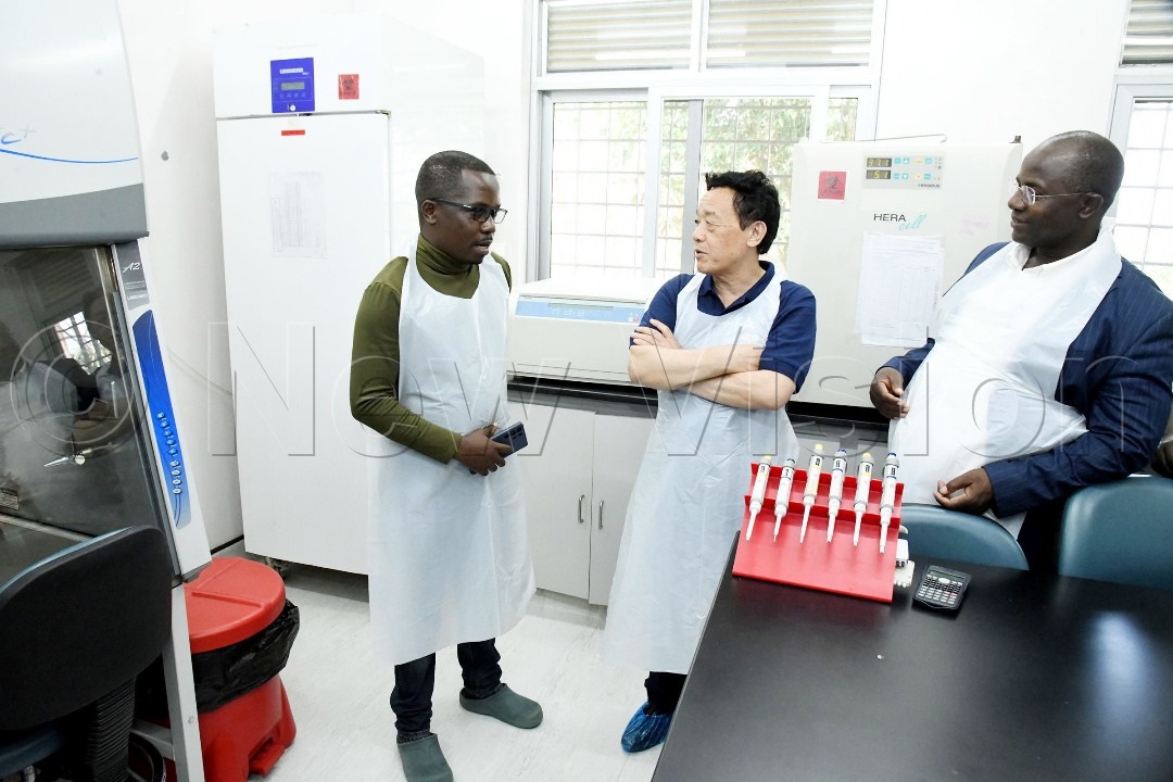 Dr Paul Ssajakambwe, Principal Investigator, Foot and Mouth Disease vaccine takes the guests through what happens in the laboratories.