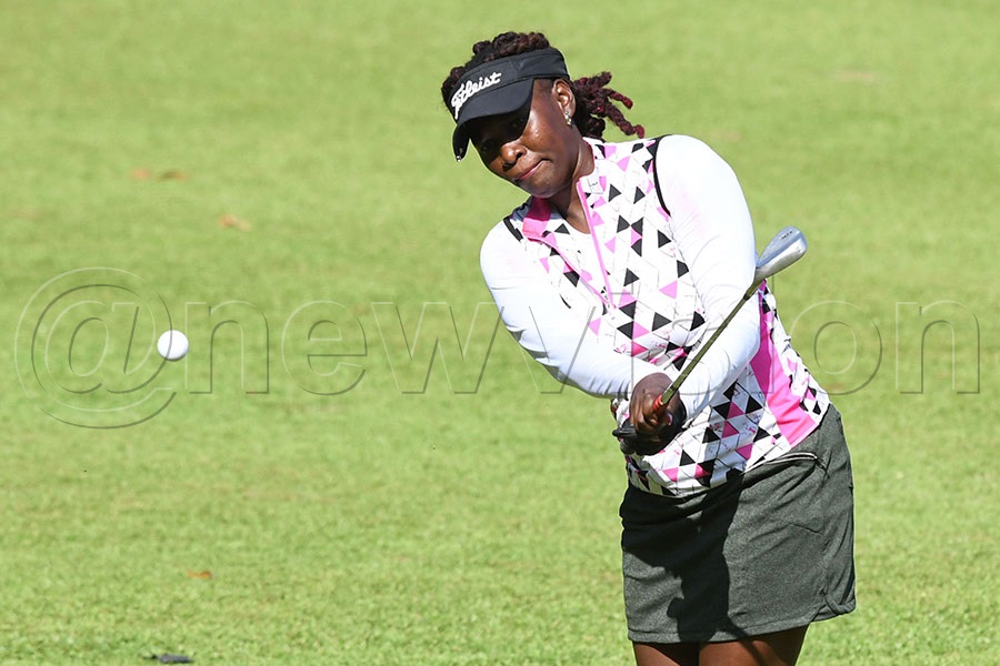 Martha Babirye chips to the 18th green during the second round. Photo by Michael Nsubuga