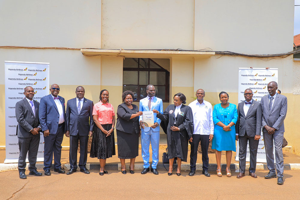 Fred Byamukama, the State Minister for Transport in a group photo with the members of the Uganda Airlines board and the CEO Jennifer Bamuturaki (centre). (Courtesy photo)