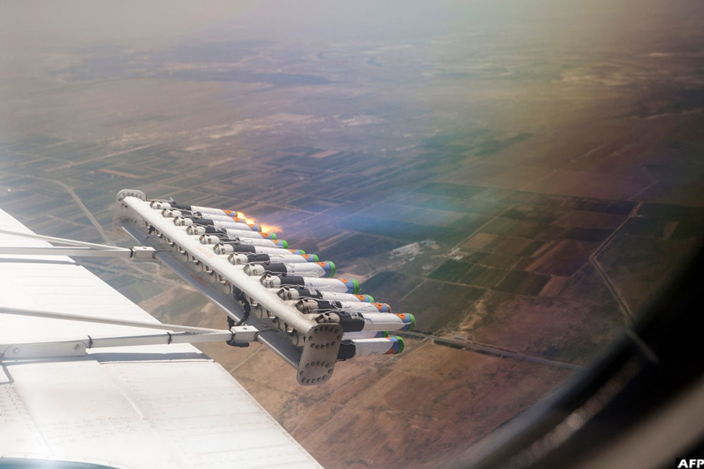 Hygroscopic (water-attracting) salt flares are seen released during a cloud seeding mission conducted by the UAE's National Center of Meteorology in the Turkistan region