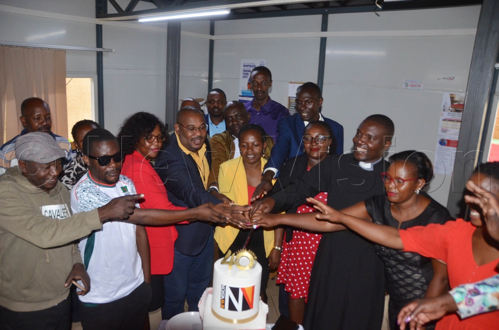Mbarara Bureau team cutting cake.