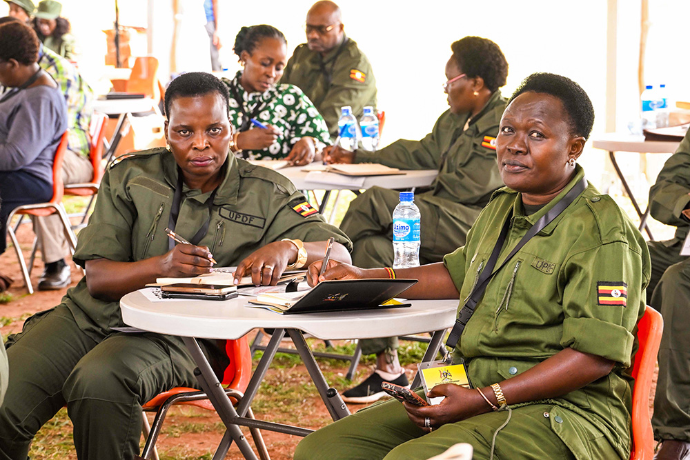 State Minister for Northern Uganda Beatrice Akello (L) and Ethics and Integrity minister Rose Lilly Akello attending the ministers retreat at Kyankwanzi on Monday. (PPU Photo)