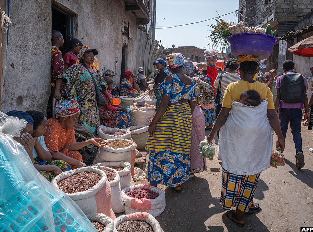 Vendors display beans for sale at the market in Goma on January 14, 2026.