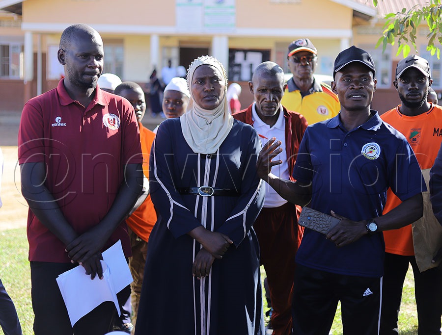 Lwengo District Sports Officer Lawrence Mukama (R) addresses trainees of woodball at Mbirizi Seed Secondary School. Looking on (C) is the school deputy headteacher Lukia Muganzi, and Buganda region woodball coordinator Ali Ahmed Kiwanuka