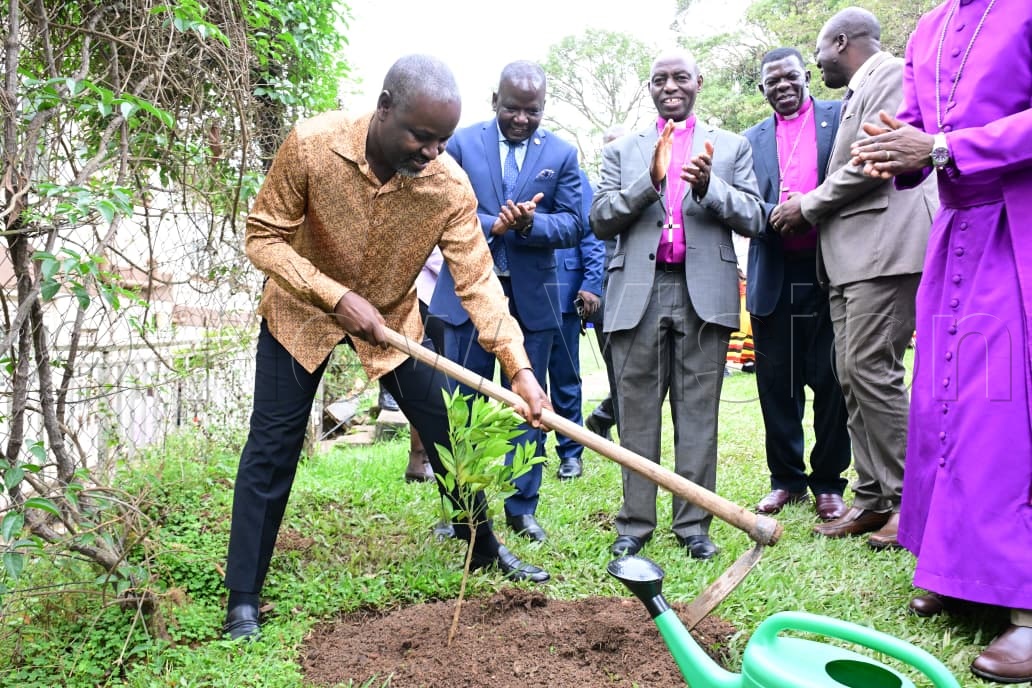 Rt. Hon. Thomas Tayebwa planting a tree.