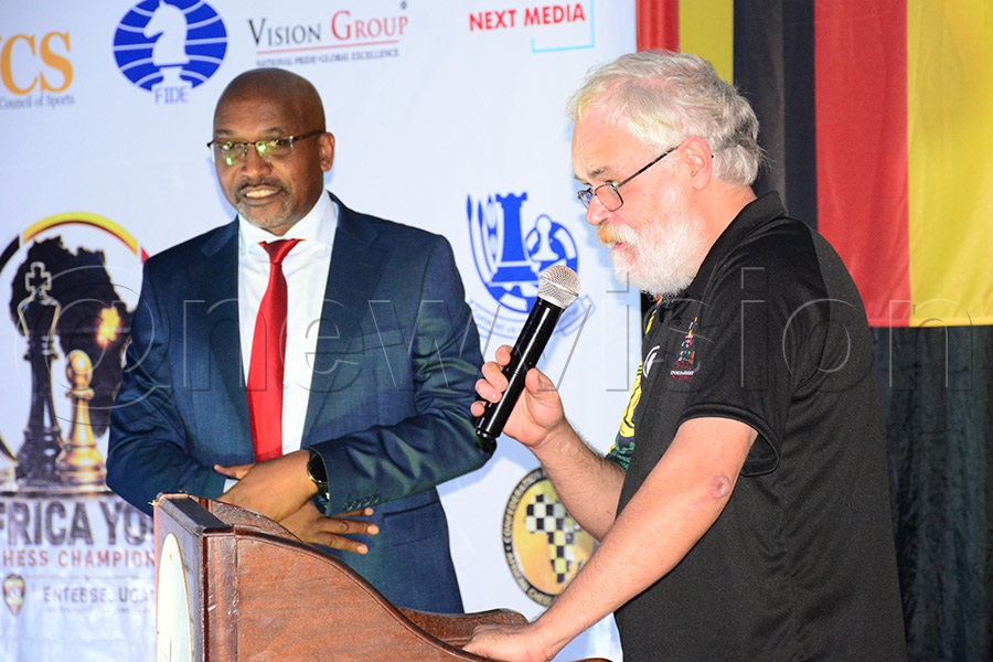 The Chief Arbiter van den Bergh Gunther (right), flanked by UCF president Andrew Bakiza, addressing participants during the opening ceremony of the Africa Youth Championship. Photo by Michael Nsubuga