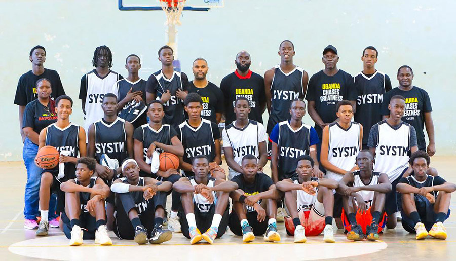 FUBA's Patricia Ayebare (extreme left) and Coaches Albert Aciko (2nd left) Henrsion Mbazira (2nd right) and Henry Malinga (right) and SYSTM Sports President Dimitrios Seymour (third right) pose with the camp participants at Lugogo. Courtesy photo.