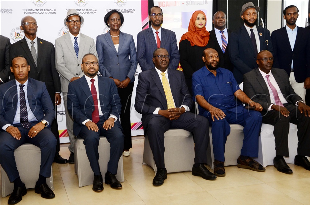 From left to Right: Ibrahim Ahmed Osman, director general ministry of commerce and industry in Somalia, Hamza Adan Hadow, Somalia Head of delegation, Vincent Waiswa Bagiire, Foreign Affairs PS, Prof. Sam Tulya-Muhika, Ambassador Richard Kabonero pose for a photo with other delegates during the second session of the Uganda-Somalia joint permanent commission at Mestil Hotel in Kampala on Wednesday, October 07,  2025. 
