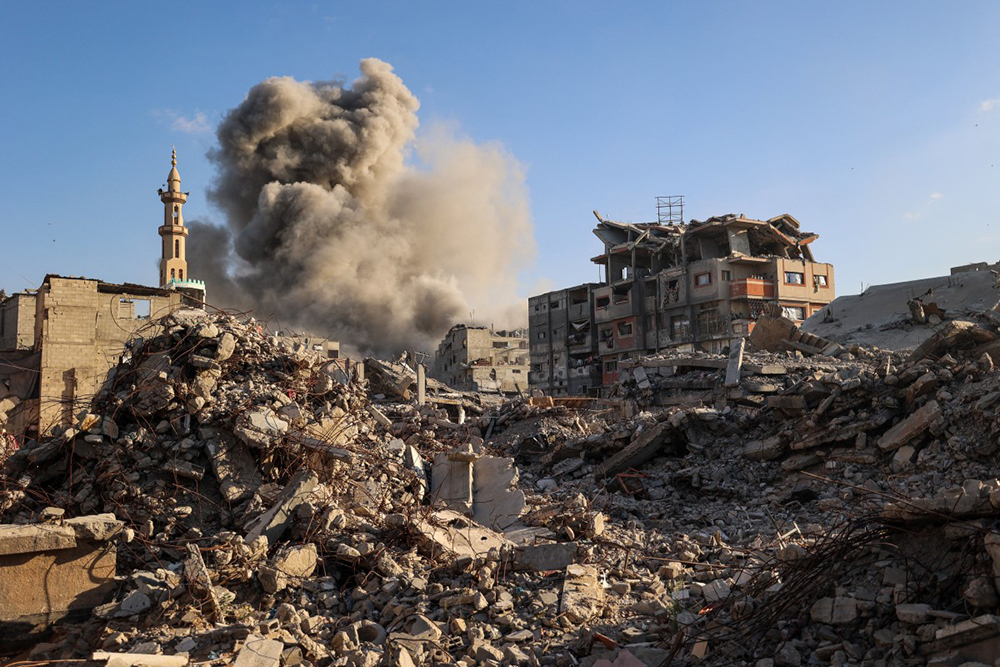 Smoke billows following an Israeli strike that targeted a building in the Bureij camp for Palestinian refugees in the central Gaza Strip on October 19, 2025. Gaza's civil defence agency said a series of Israeli air strikes on October 19 killed at least 11 people across the territory, as Israel and Hamas traded blame for violating a ceasefire.