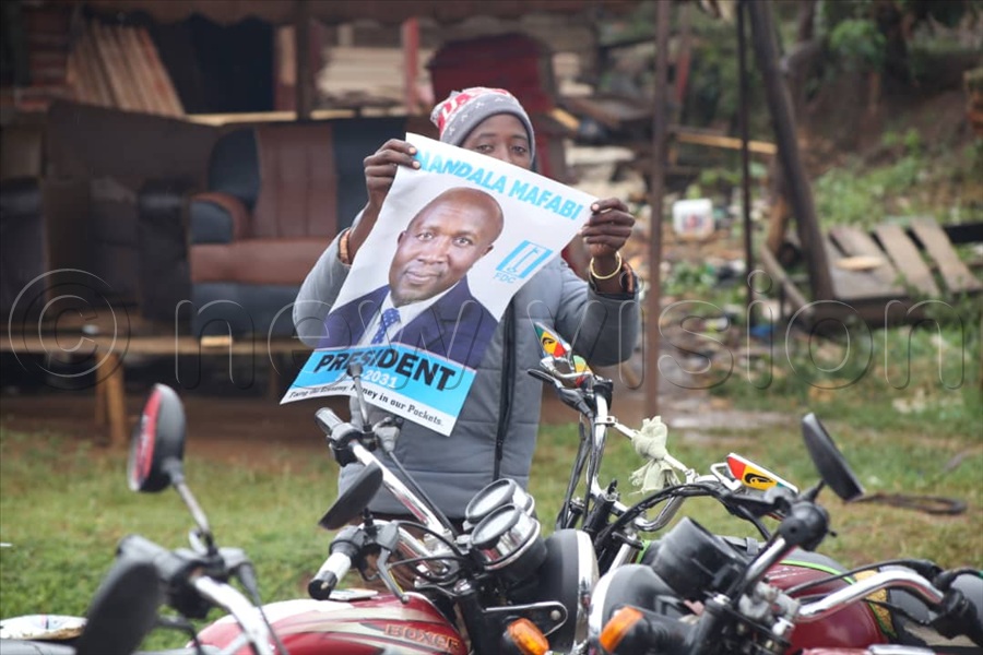 At every rally stop, supporters who took to the microphone raised questions about Besigye’s detention, with many chanting “Free Besigye!” as Nandala's convoy slalomed through the district. (All Photos by Alfred Ochwo)