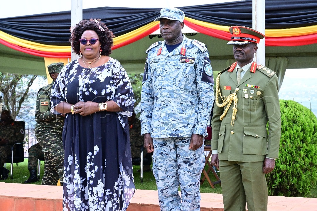 Col Mike Charles Mbulachalo (right) gets his new pips.