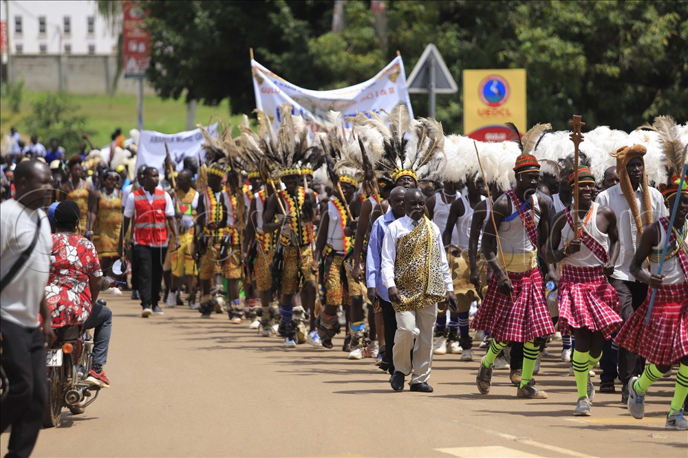 Exhibiting different cultural attire and musical instruments on Gulu city streets.  