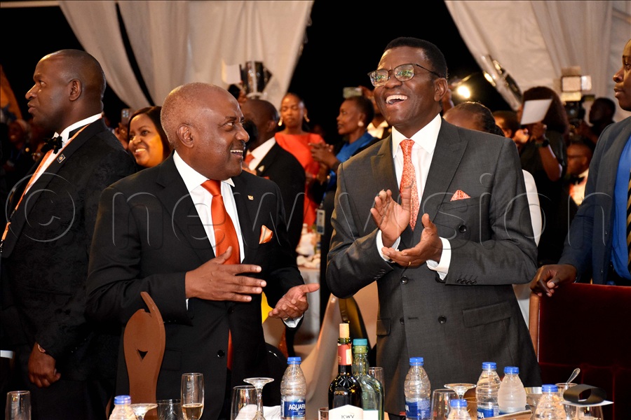 Emmanuel Katongole, Rotary International director sharing a light moment with Charles Peter Mayiga, the Katikkiro of Buganda during the 101st District Conference & Assembly at Speke Resort Munyonyo in Kampala. (Credit: Simon Peter Tumwine)