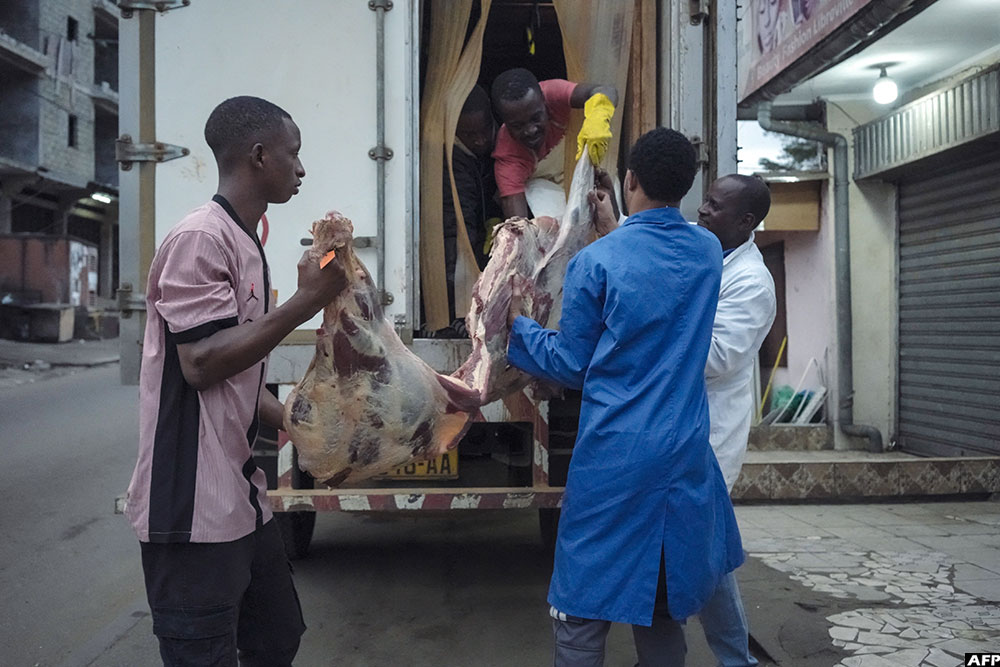 Workers deliver Nyanga Ranch meat to Youssouf Ori’s butcher shop in Libreville on September 9, 2025. (AFP)