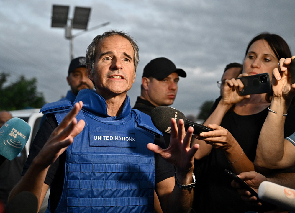 International Atomic Energy Agency (IAEA) chief Rafael Grossi talks to the press on a road outside Zaporizhzhia city, after his visit to the Russian-held Zaporizhzhia nuclear power plant in southern Ukraine on September 1, 2022, amid the Russian invasion of Ukraine. (Credit: AFP)
