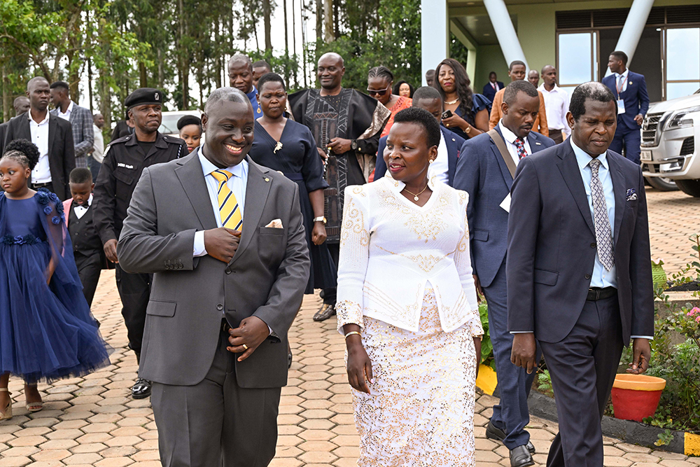 Pastor Kenneth Kato (L) taking Hon. Beatrice Akello the State Minister for Economic Monitoring and Pastor Robert Kayanja (R) on a guided tour of Life Restoration Ministries church during its commissioning. (PPU)