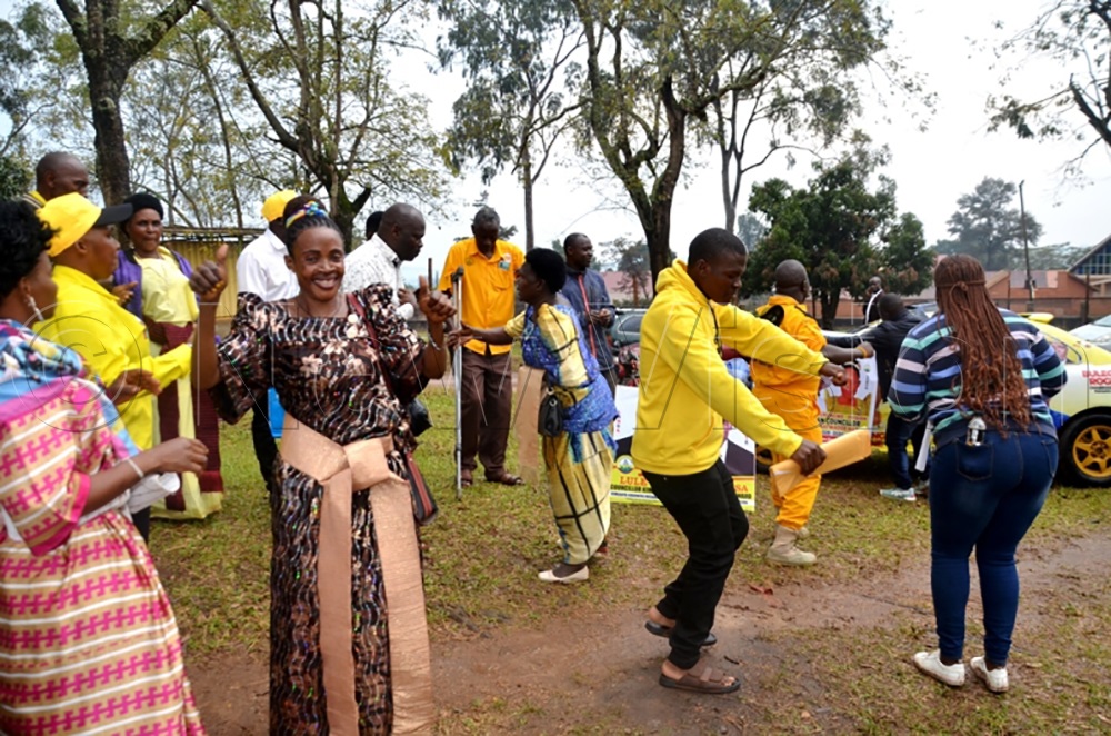 NRM party supporters in Masaka City dancing outside the EC nomination Centre Sazza in Masaka City. (Photo by Dismus Buregyeya)
