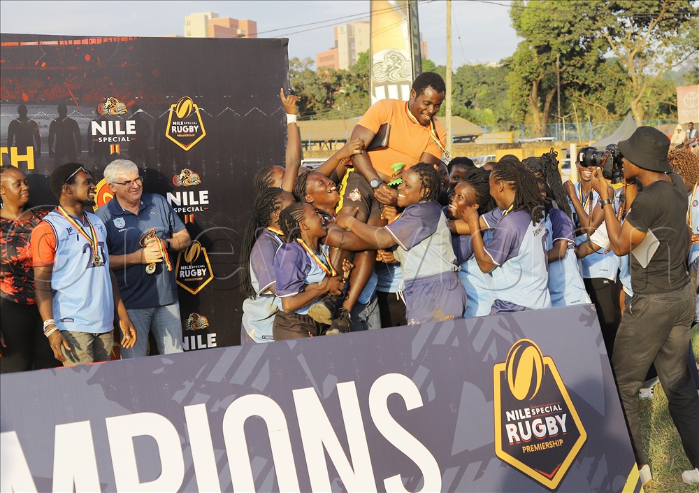 Thunderbirds Coach Kigongo Ssebalamu lifted high by his players after winning the League.
