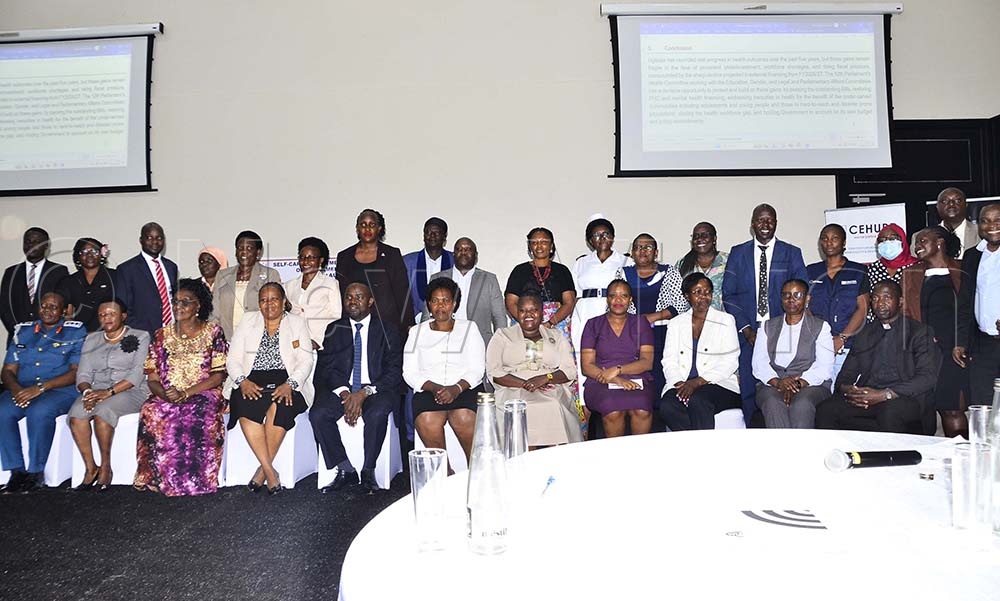 Dr Richard Mugahi (second left) Health ministry Commissioner Reproductive and Child Health poses for a photo with members of parliament and other health experts during the orientation meeting on selfcare, Sexual Reproductive Health at Mestil Hotel in Nsambya on 18th August 2026. (Credit: Juliet Kasirye)