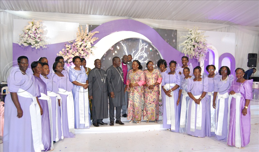 The Banjas share a photo-moment with the clerics' spouses during their reception at Mengo Senior School.