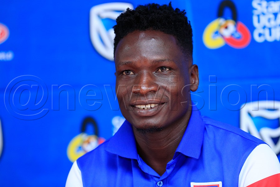 Owori speaking at a press conference