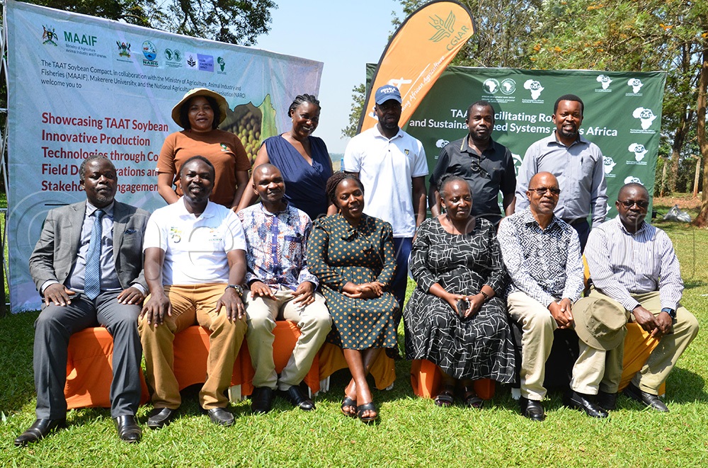 Some of the experts who facilitated the soybean field tour and training at Namulonge, on Monday, December 1st, 2025, posing for a group photo (Photo by Stuart Yiga)