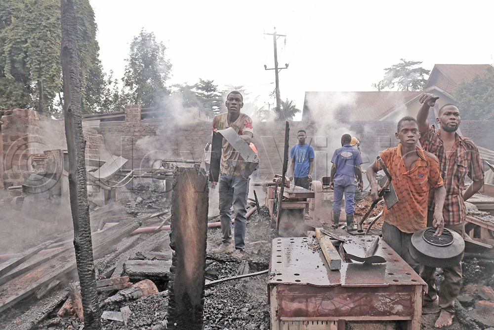Timber dealers showed destroyed machinery after a devastating fire tore through their yard next to the Mogas fuel station in Seeta, Mukono district, in the early hours of April 15, 2026. (Photo by Joanita Nakatte)