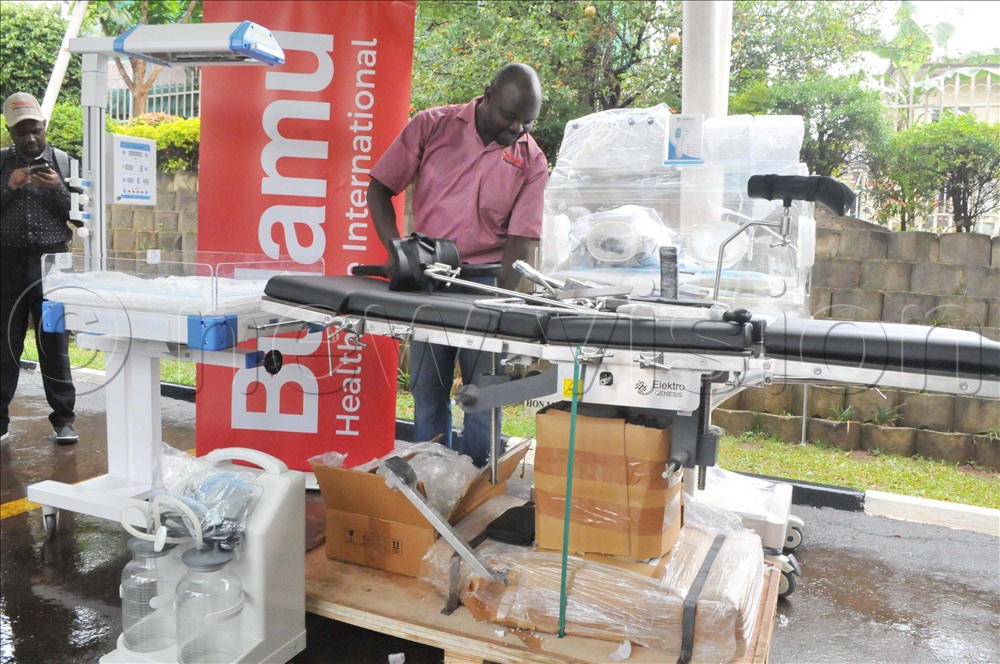 Richard Businge, the Director of Maternal Newborn and Child Health Services at Bulamu Healthcare International, inspecting some of the machines before the flagging off of some Neonatal Care Unit equipment at the Ministry of Health