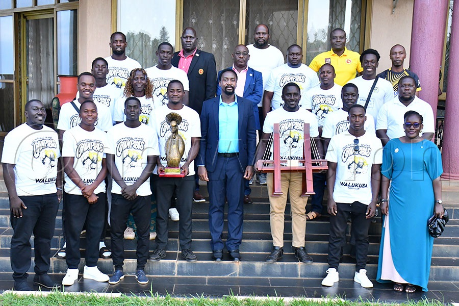 Kyabazinga of Busoga William Gabula Nadiope IV (middle) in a group photograph with team players and managment of Walukuba Barbarians Rugby Club at his Igenge Palace in Jinja City on Friday.   Photo by Donald Kiirya
