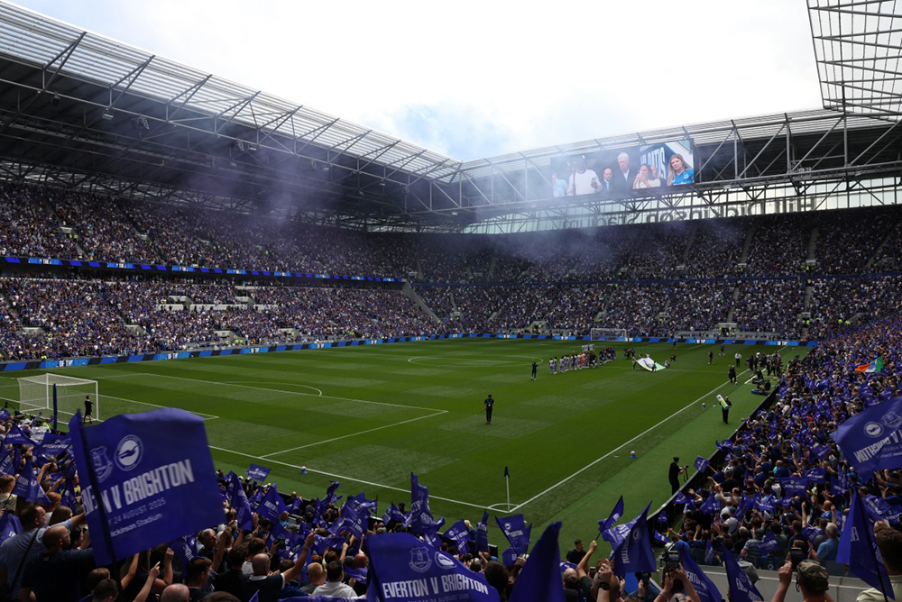 Players walk out onto the pitch ahead of the English Premier League football match between Everton and Brighton and Hove Albion at Hill Dickinson Stadium in Liverpool, north west England on August 24, 2025.