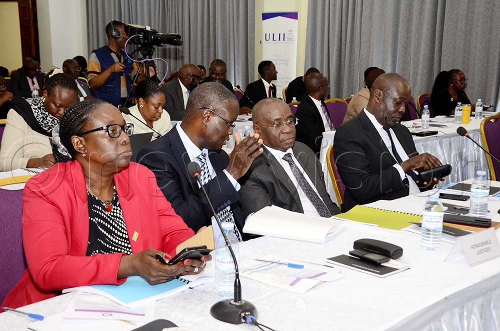 Judicial officers interacting during the validation meeting of the draft training manual and curriculum on the resolution of election disputes resolution organized by the Judicial Training Institute at the Court of Appeal in Kampala on November 07, 2025. (Credit: Juliet Kasirye) 