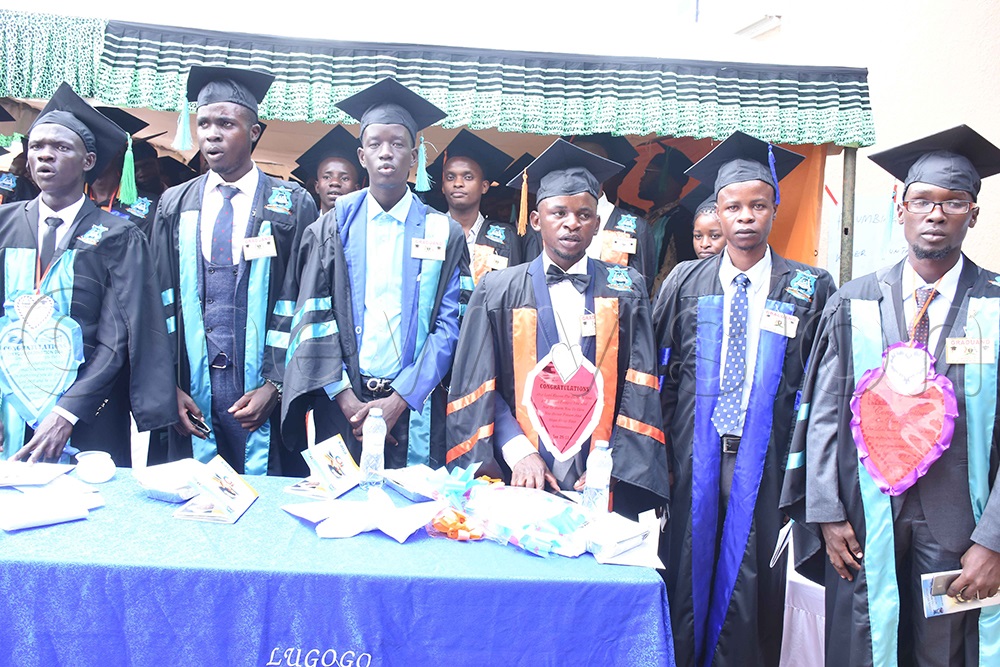   Gerald Kazungu ( right), the Best performing student of 2023 and other graduands during the graduation ceremony. (Photo by Dickson Kulumba)