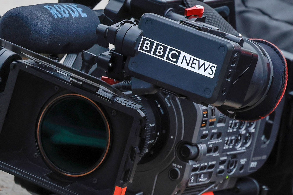 a BBC News camera kit resting on the floor outside La Sante prison, in Paris on November 10, 2025. (AFP)