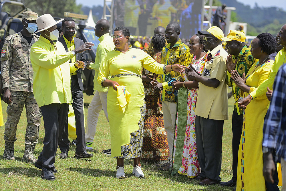 President Museveni accompanied by the speaker of parliament, Anita Among, welcomed by district officials upon arrival at the campaign rally. (PPU)