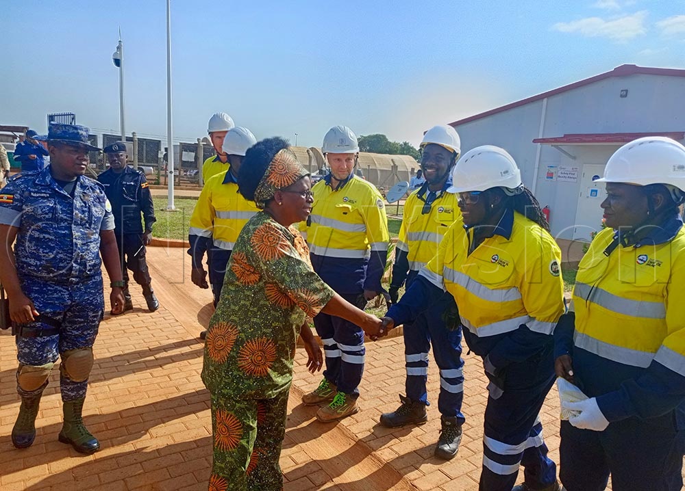 The minister (left) greeting some of the EACOP officials at her arrival at PS1 during her readiness check visit.