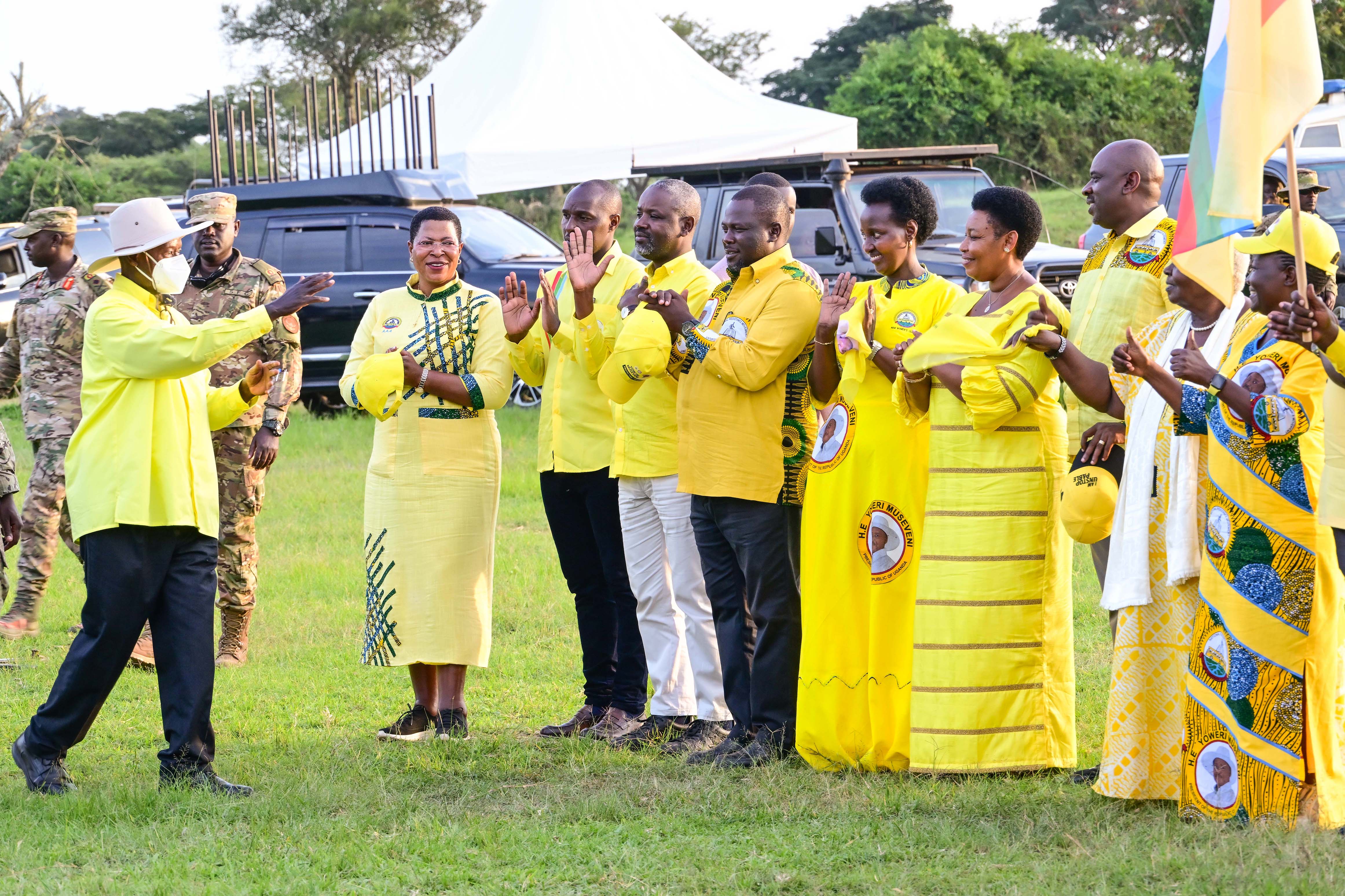 President Museveni greets some of the senior government and NRM party officials during his campaign rally at Nyakasharara play grounds in Kiruhura district on Friday. 