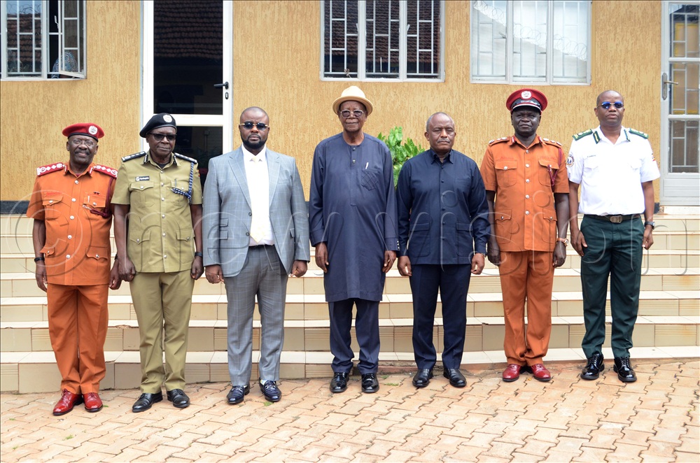Internal Affairs Ministers Juma Witonze Kisekka (3rd left) and Ephraim Kamuntu (4th left) with their technocrats during the state minister’s office handover held at their offices in Jinja road on August 12.