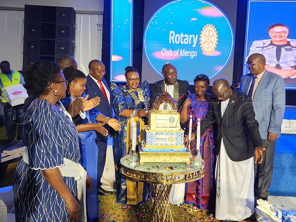 Monica Byarugaba, the newly installed president of Inner Wheel club of Mengo and Fred Kafeero, the newly installed President for the Rotary Club of Mengo, join other dignitaries to cut the cake during their joint installation event. This was at Pope Paul Memorial Hotel, Rubaga, Kampala, on May 15, 2026. (Photo by Lawrence Mulondo)
