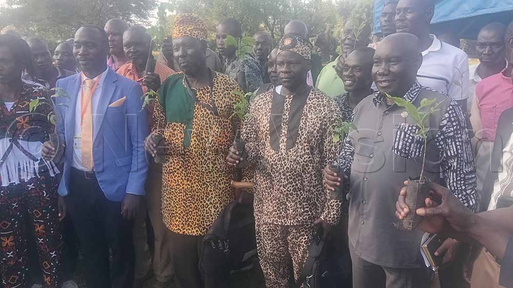 Cultural leaders and farmers displaying Robusta Elite Coffee during the symposium. (Credit: Delux Emmy Alomu)
