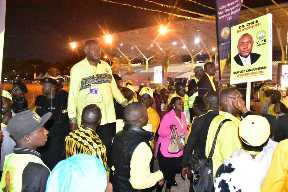 Information minister Dr Chris Baryomunsi and hs supporters look on during the vote counting process at Kololo. (Photo by Joseph Mutebi)