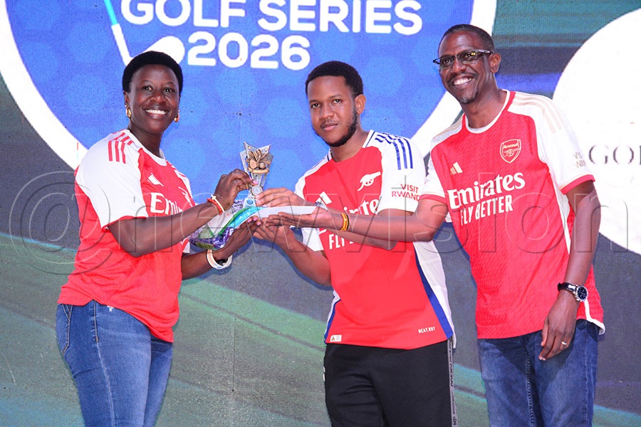 Gross winner Peace Kabasweka (left) receives her prizes from the Minister of Defence and Veterans Affairs Kiryowa Kiwanuka (right) and his son Mugambe Kiwanuka after the after the second quarter Katogo championship at Entebbe Club, May 30, 2026. Photo by Michael Nsubuga