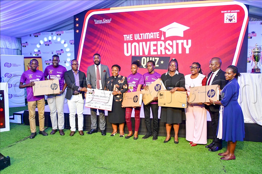 The senior information officer Parliament of Uganda, Ibrahim Manzil (3rd left) and the acting director of corporate affairs of the Uganda Communication Commission, Emmanuel Nwoyomba (4th left) handing over gifts to the Vice Chancellor of Ndejje University, Rev. Canon Prof. Olivia Nassaka Banja (5th left) and the students after emerging 2nd in the Ultimate University quiz season three. This was during the awarding ceremony at Vision Group head offices in Kampala on Thursday, November 27, 2025. (All Photos by Miriam Namutebi)