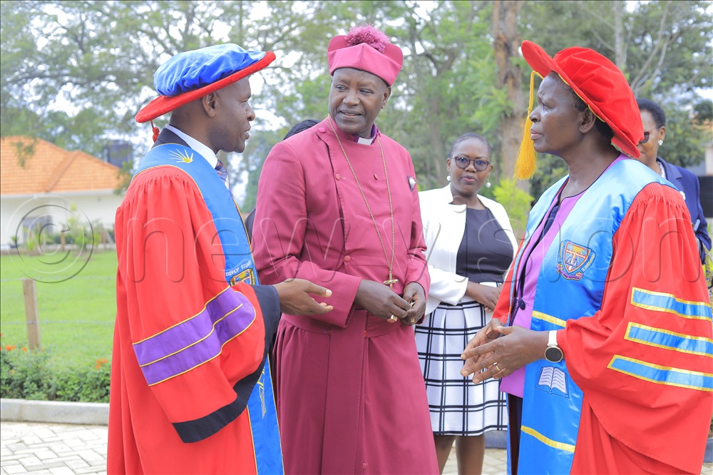 Canon Dr Kedress Turyagyenda, Permanent Secretary, Ministry of Education (right), Emeritus Bishop Nathan Kamusiime Gasatura of Butare Anglican Diocese of Rwanda (centre) and Bishop Stuart University Vice Chancellor, Prof Mugisha (left) interacting shortly after the commissioning service of Bishop Stuart University’s 22nd graduation ceremony, which was held in the university library complex on Thursday.