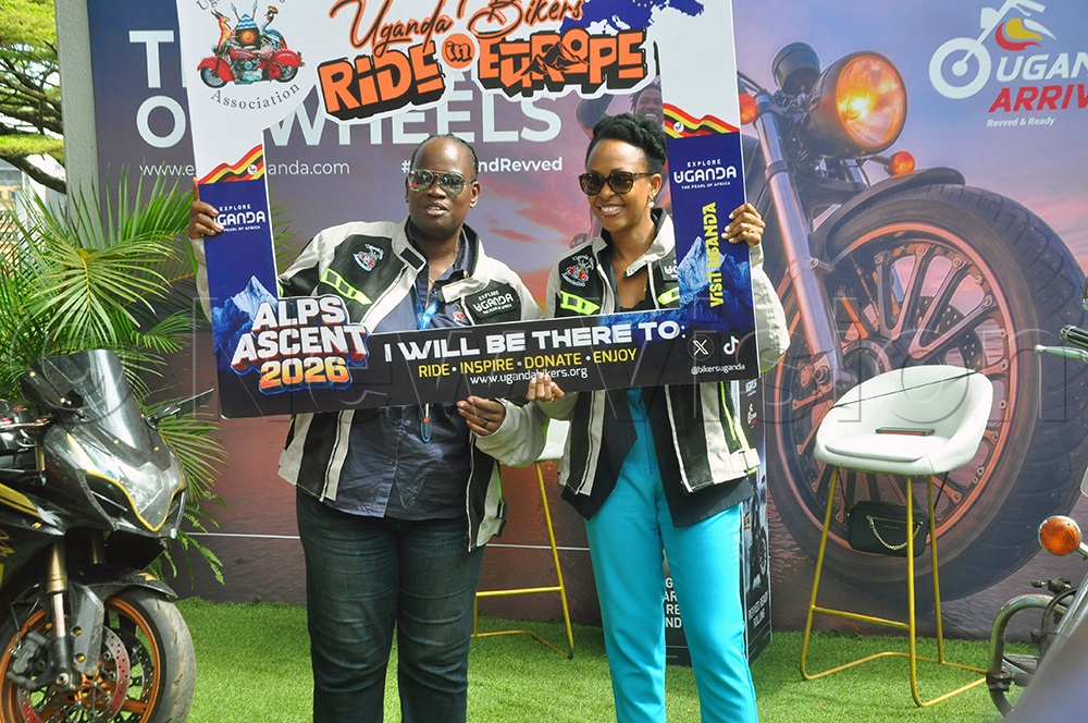 Ssemukuttu (Left) and Kagwa (Right) during the launch of the motorcycle tour in Europe dubbed &lsquo;Pearl on Wheels&rsquo; at the Sheraton Kampala Hotel. (Photo by John Odyek)