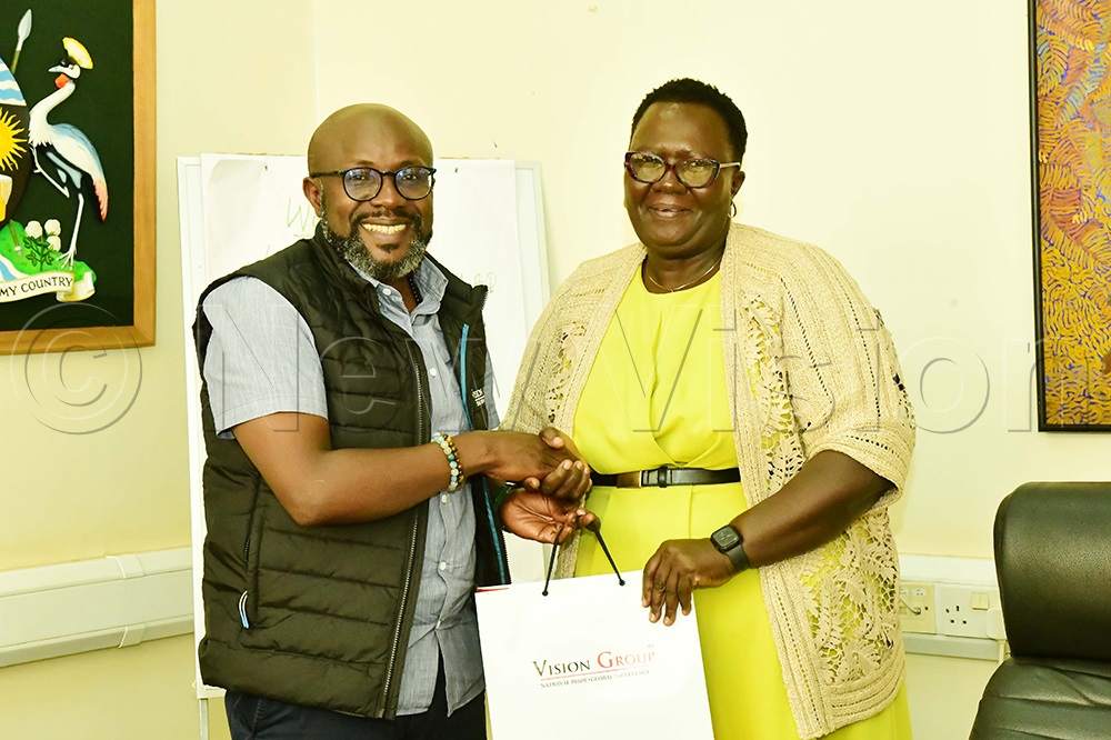 The Vision Group CEO/MD, Don Wanyama (left) handing over a gift to Jane Godia, the WANIFRA’s Women in News (WIN) organisation during a courtesy call at the Vision Group head office in Industrial Area, Kampala, August 18, 2025. (Photo by Eddie Ssejjoba)