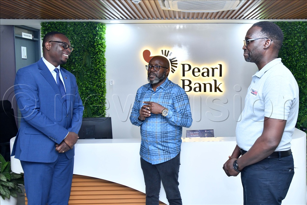 Julius Kakeeto, the Pearl Bank Managing Director, Chief Executive Officer of Vision Group, Don Wanyama and New Vision Editor-in-Chief Sidney Miria Babanga during a courtesy visit at the Pearl Bank Headquarters in Kololo earlier today (Friday).