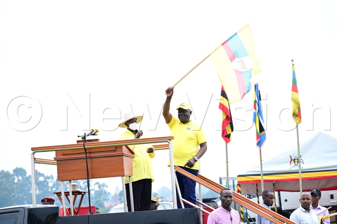 Kalungu East NRM parliamentary flag bearer Vincent Ssempijja, waving the NRM flag. (Credit: Eddie Ssejjoba)