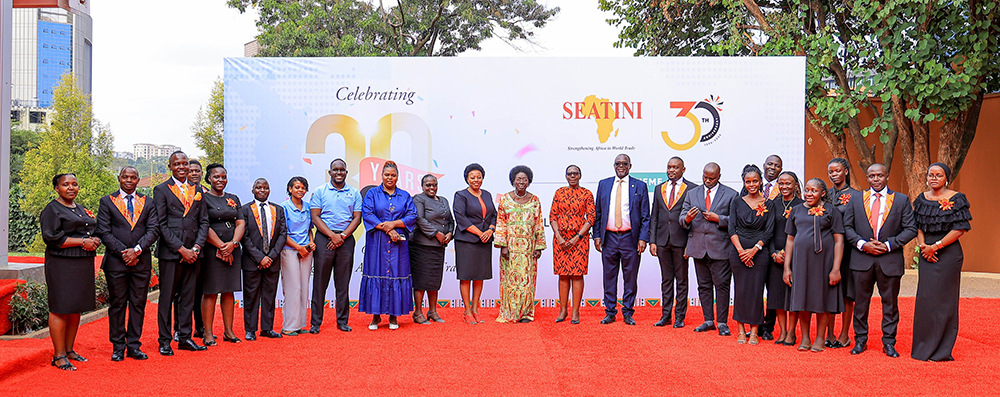 Kadaga (centre), joined by SEATINI staff, poses for a photo moment during the organisation’s 30th anniversary celebrations at Kampala Serena Hotel. (Courtesy)