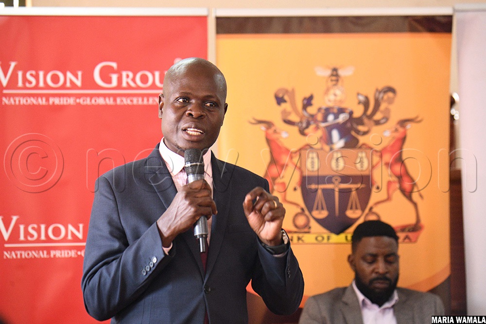 Bank of Uganda head of stakeholder engagement Jonah Waiswa talking to students about the Ultimate University Quiz Challenge. (Photo by Maria Wamala)